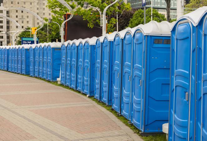 a row of portable restrooms ready for eventgoers in Biola